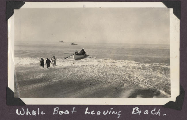 Whale boat leaving beach