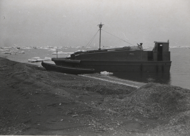 Survey launch and skiff in water