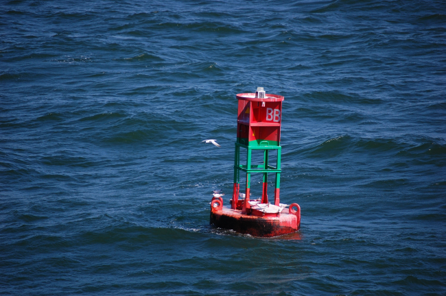 Preferred channel buoy with red top meaning pass buoy to starboard sidewhen returning from sea
