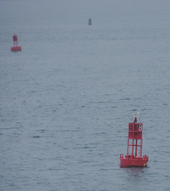 Channel indicating tight turn to starboard past second red buoyas next buoy in sight, a green buoy, must be kept to port when proceedinginbound