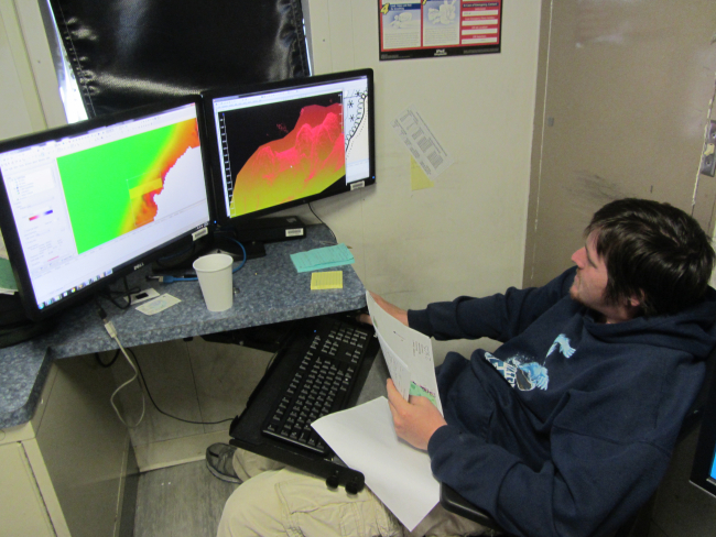 Mark Bradley, hydrographic survey technician, using 3D imagery to confirmuncharted rock in navigational waters