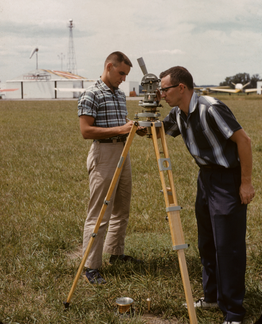 Surveyor taking sun azimuth for true direction to determine magnetic declination from magnetic observations