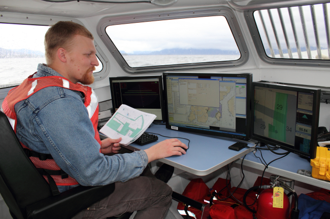 Survey technician monitoring hydrographic survey operations