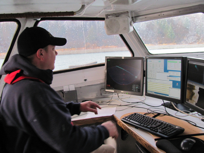 Hydrographic survey technician monitoring sonar