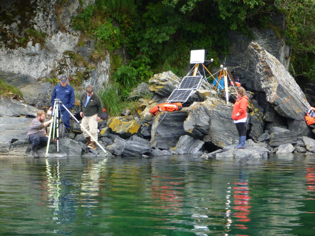 A tide gauge and horcon station (horizontal control) being set up in Terror Bay