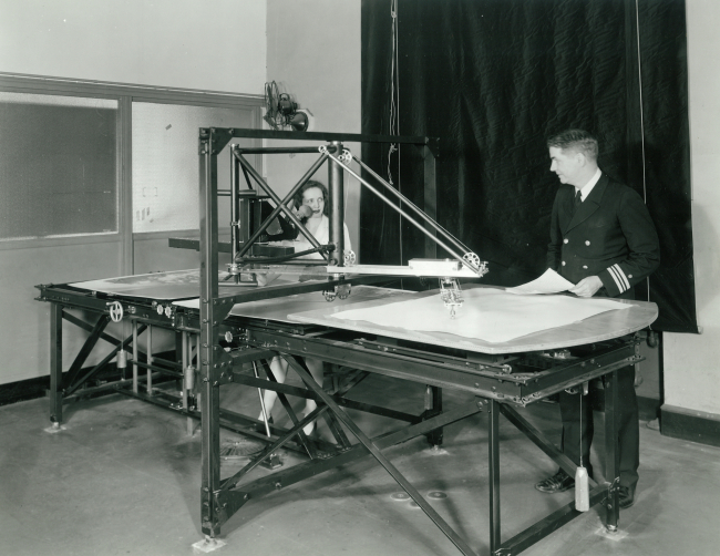 Woman operating early stereoplotter