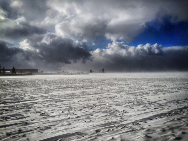 The first large winter storm of 2015 rolls over a frozen Sandusky Baywith 30-45 mph winds