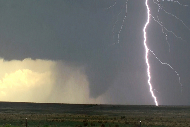 Tornado with branched cloud to ground lightning, east of Trinidad, CO