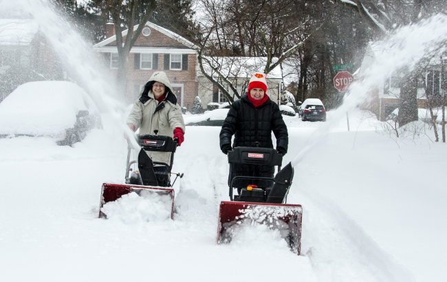 Good neighbors Rina Kolnik and Gingie Glover didn't wait for the countyto get their street cleared of a major snow fall