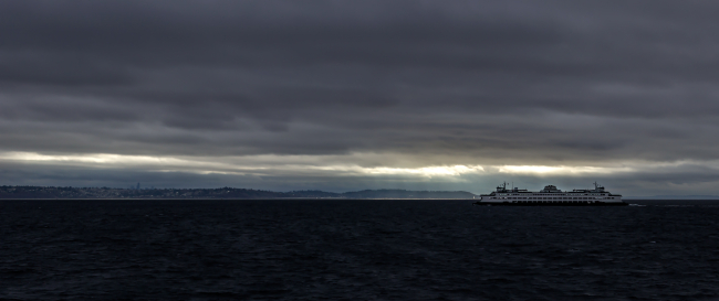 A Washington State ferry slipping through Puget Sound on a  blustery day