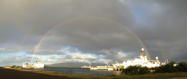 NOAA vessels framed by a double rainbow