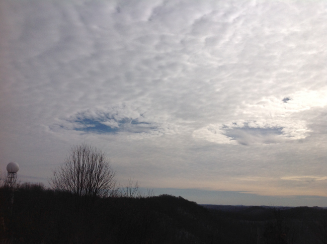 Hole punch clouds with the National Weather Service Jackson, KYDoppler Radar viewable in the background