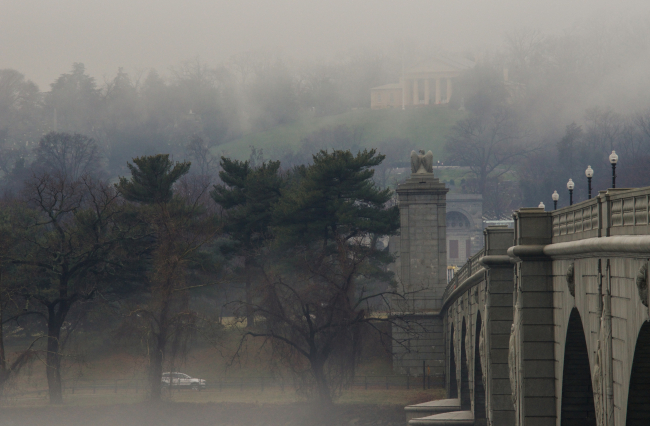Looking west along the Arlington Memorial Bridge to Arlington NationalCemetery and the Lee-Custis mansion on a foggy day