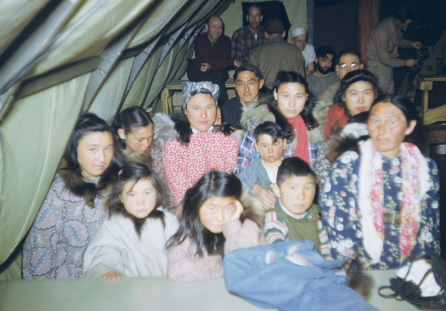 Eskimo women and children at the Oliktok Point camp mess hall