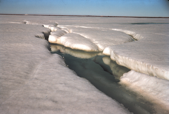 The first sign of the spring melt - a stream is seen flowing on the ice