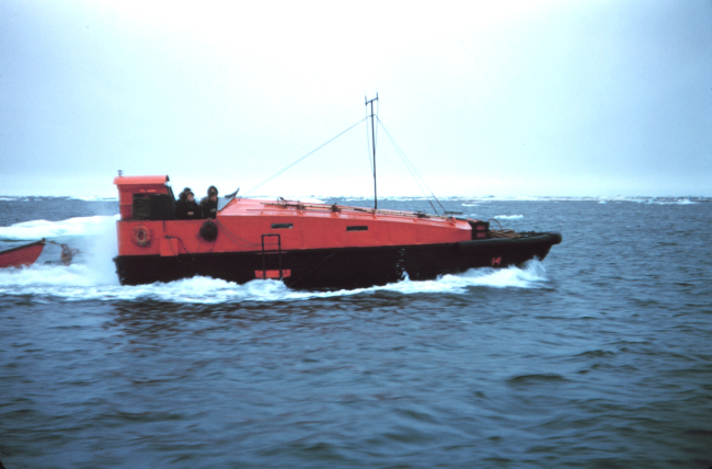 Survey launch #14 towing a dinghy