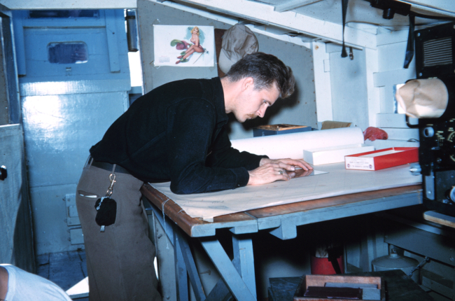 Harley Nygren working on a hydrographic survey sheet on Survey Launch #15