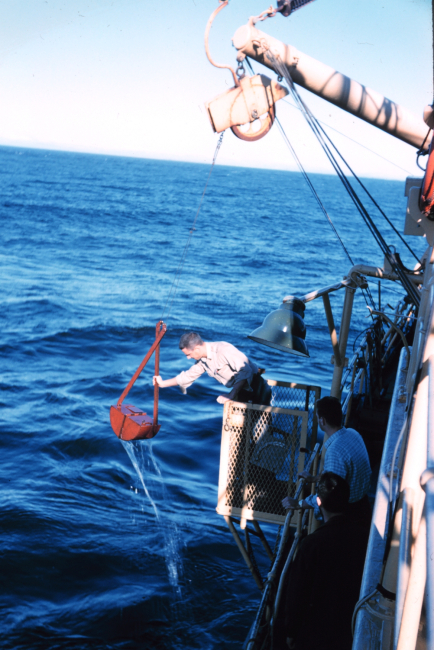 Deploying a Van Vehn grab sampler from the Bureau of Commercial FisheriesShip BROWN BEAR