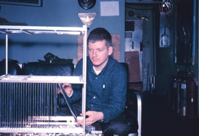 Fred Walton working on scientific equipment at South Pole Station