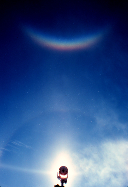 Arc with reflection higher in the sky - note reversal of spectrum
