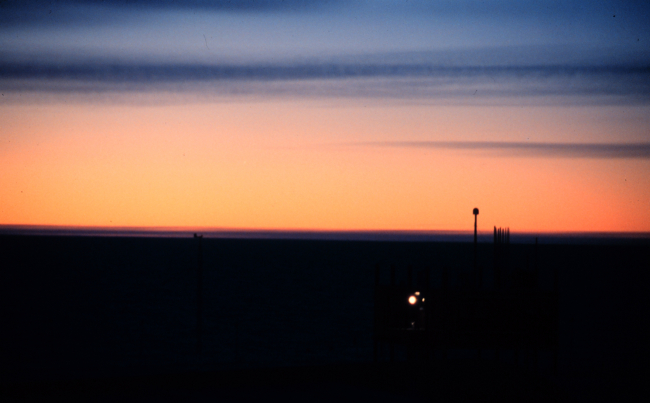 March sunset silhouetting the Clean Air Facility
