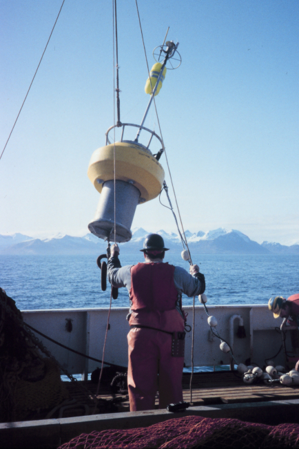 Deploying a small oceanographic buoy off the MILLER FREEMAN