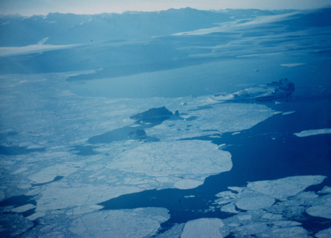 Flying over large tabular icebergs on the way to McMurdo Sound
