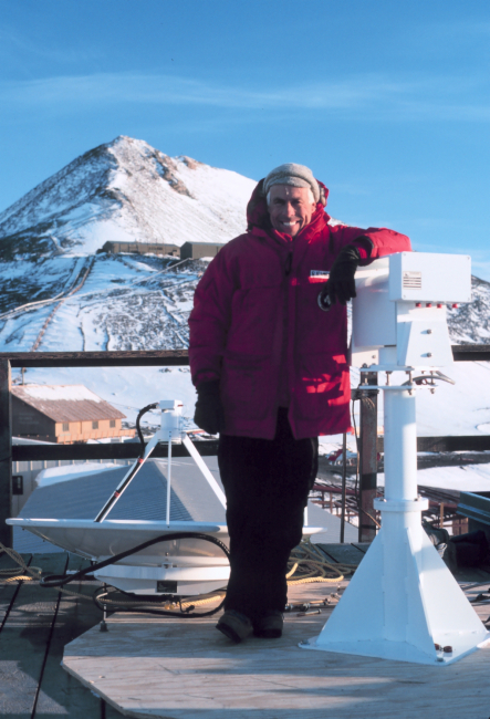 Installing a satellite data receiving antenna on top of the weather building atMcMurdo Station