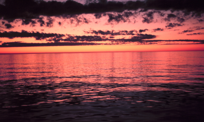 Red sky above reflecting off a red sea below
