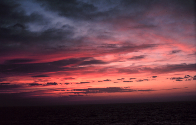 A last gasp of color decorates the sky as night approaches over the open ocean