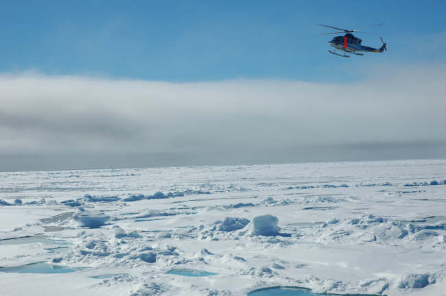 Search and rescue helicopter over Arctic sea ice