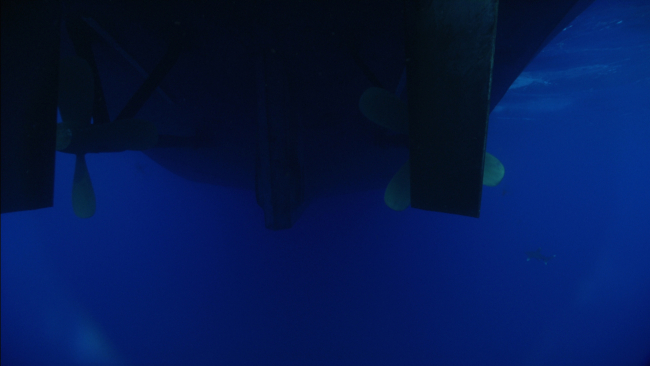 The propellers and rudders of the OKEANOS EXPLORER are seen fromLittle Hercules during a recovery operation