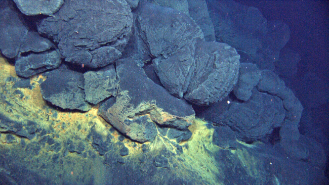 The cooled pillow lava seen here forms when eruptions spread at relativelyslow rates