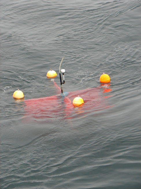 Improvised drifter buoy with navigation receiver and transmitter