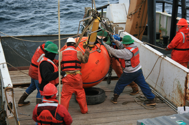 Deploying oceanographic buoy from stern of NOAA Ship MILLER FREEMAN