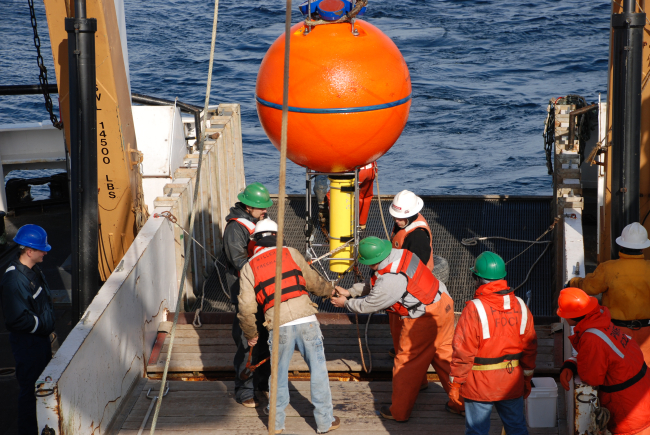 Making last minute adjustments to oceanographic buoy