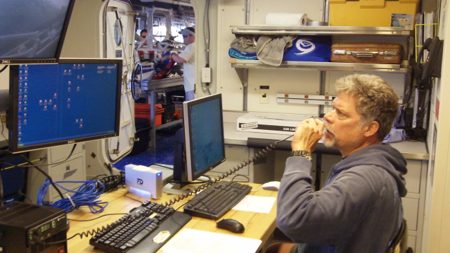 Scientist on NOAA Ship PISCES communicating with bridge