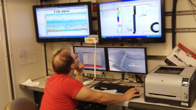 Member of science party on NOAA Ship PISCES monitoring acoustics and navigation