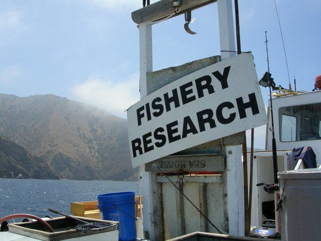 Sign on stern of F/V SEAHORSE indicating its use as a contract fisheriesresearch vessel