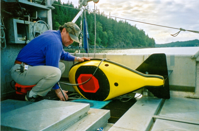 David Csepp and 38 kHz hydroacoustic tow fin used to conduct acoustic surveys