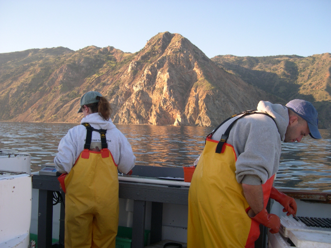 Jen Cramer and Chris Harvey working off Catalina aboardthe F/V MIRAGE during 2004 hook and line survey