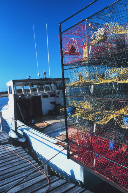 A blue crab fishing boat loaded with pots and ready to go to work