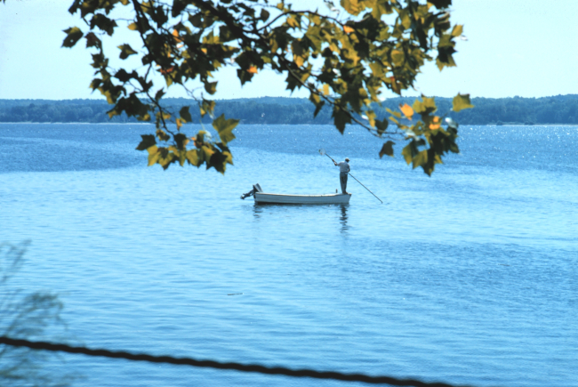 Clam fishing from a skiff requires good balance