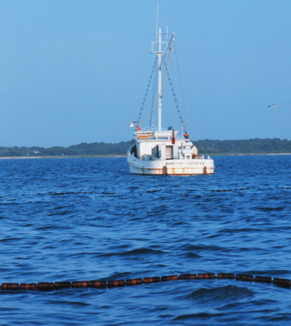 Menhaden fishing - mother vessel as seen over the floats on the net