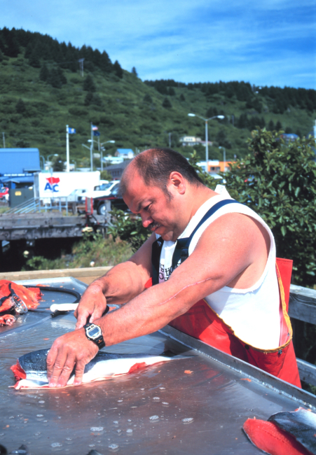Filleting salmon in anticipation of a community fish fry  in support of the United Seiners Association