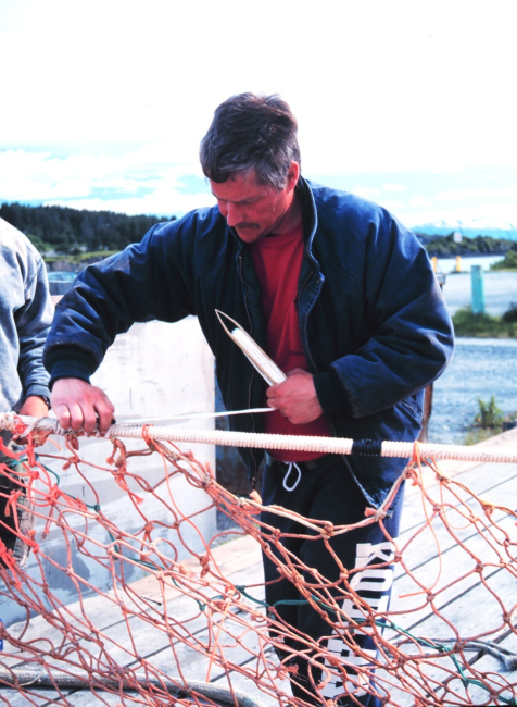 Fishermen mending nets at St