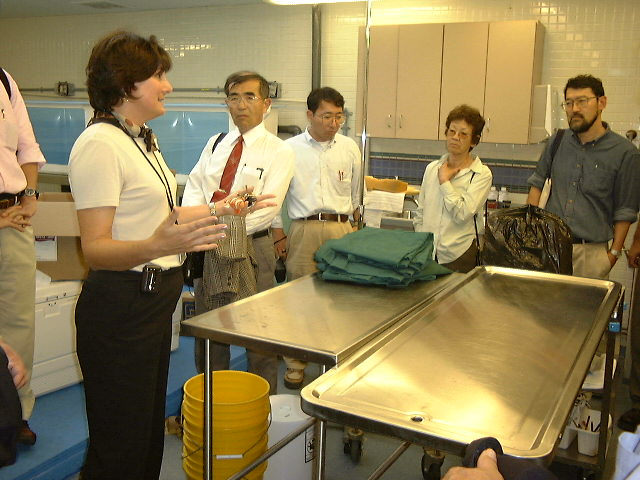 Epcot Living Seas Aquarist, Jane Davis, discusses health proceduresin the veterinary laboratory while Dr