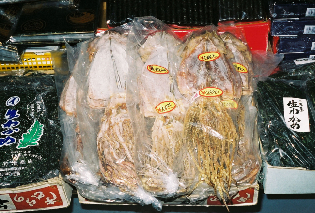 Packages of dried squid in the center and nori, porphyra, on the sides forsale that the Shiogama market in Japan