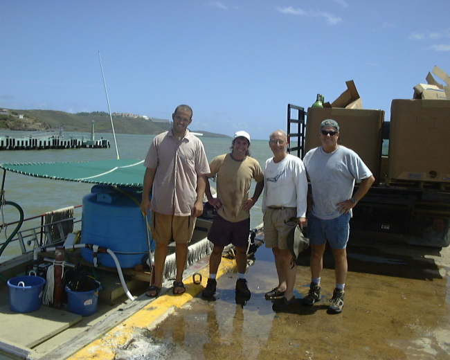 Staff preparing boat to tranport juvenile cobia to offshore cage in Puerto Ricoat Culebra Island