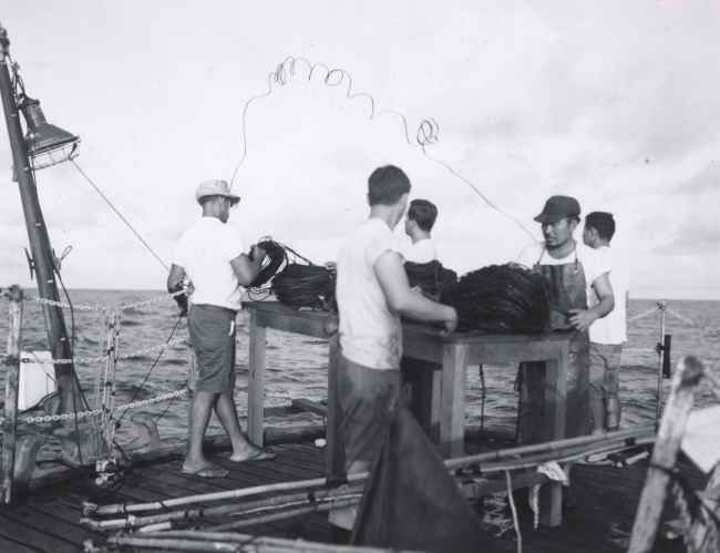 Professional fishermen from FWS Honolulu Laboratory setting longline gear offstern of research vessel ANTON BRUUN